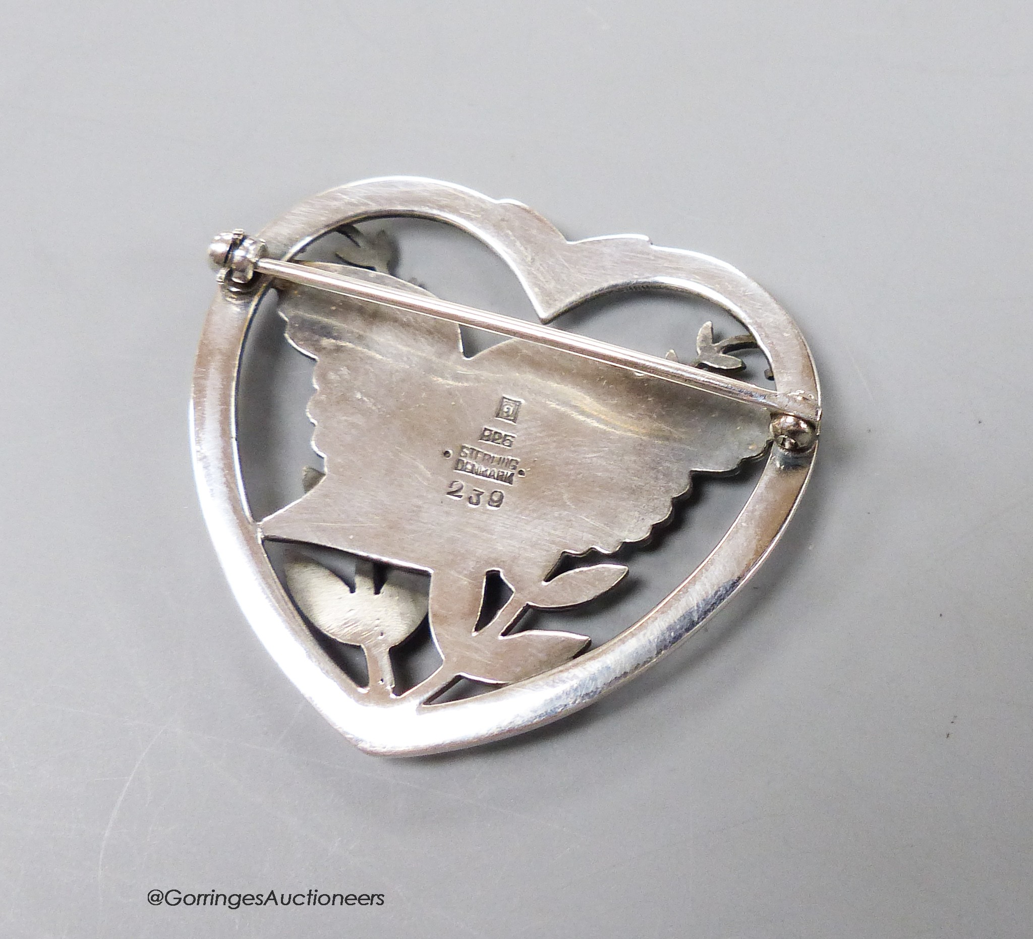 A Georg Jensen sterling heart shaped, 'bird amid foliage' brooch, design no. 239, 37mm.